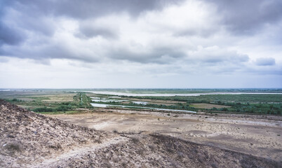 Panoramic view of the Amu Darya River and the fields irrigated by it in the desert of Uzbekistan in Karakalpakstan