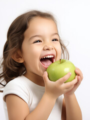 Fototapeta premium happy Child with ideal teeth eating green apple. Little Handsome girl with Health food. advertising of dentistry and healthy lifestyle