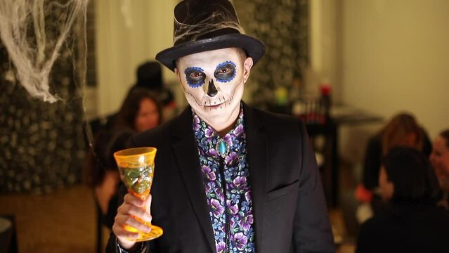 Man dressed like a cool skeleton for a Halloween party 