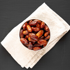 Organic Dry Deglet Nour Dates in a Bowl, top view.