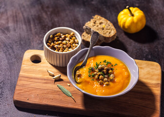 Homemade pumpkin soup with crispy roasted chickpeas	 - 675252326