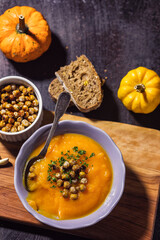 Homemade pumpkin soup with crispy roasted chickpeas	 - 675252348