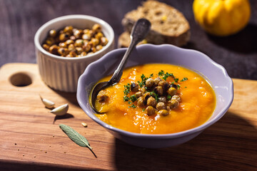 Homemade pumpkin soup with crispy roasted chickpeas	 - 675252394