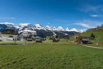 Fototapeta na wymiar View of the snowy Churfirsten mountains in the Swiss Alps, Toggenburg, Wildhaus-Alt St Johann, Canton St. Gallen, Switzerland