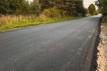 Close-Up Texture of Fresh Hot Asphalt on a New Road. Road Construction. Layers of Fresh Hot Asphalt...