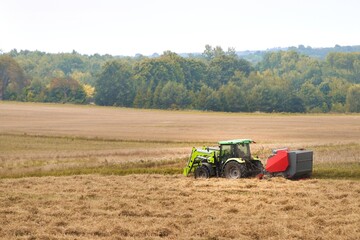 Agricultural Industry in Action. Wheat Harvesting on the Farmland. Combine Harvester at Work in the Golden Field.