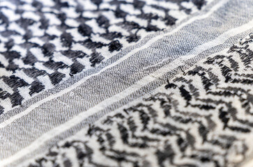 close-up of a Palestinian headscarf or kufiya. The traditional black and white headscarf of the...