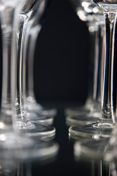 Extreme close up of empty wine glasses lined up
