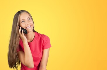 Optimistic young woman with a mobile phone