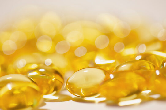Extreme close up of cod liver oil capsules

