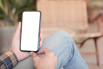 cell phone blank white screen mockup.hand holding texting using mobile on desk at office.background empty space for advertise.work people contact marketing business,technology