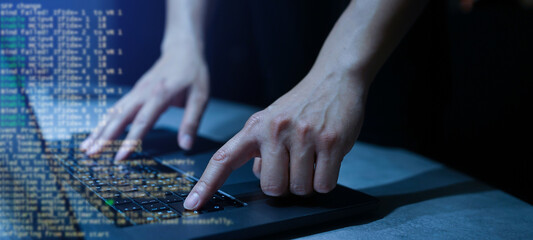 programmer man hand typing command on keyboard 's laptop to checking defect code language of...