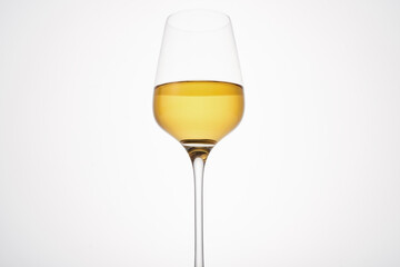 White wine fills half glass. Champagne flute.