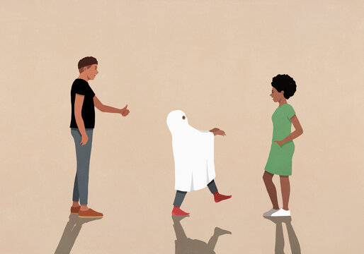 Parents watching daughter playing in ghost costume
