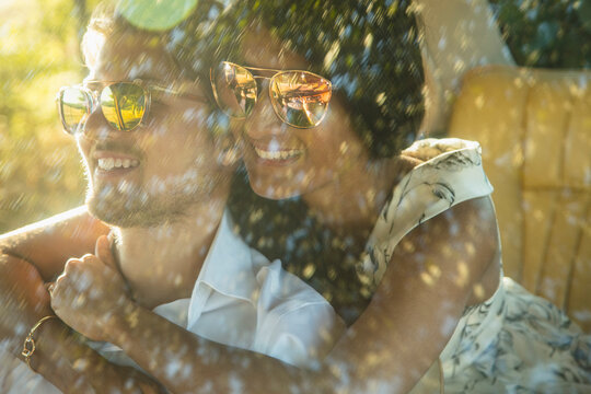 Woman Embracing Man inside Car
