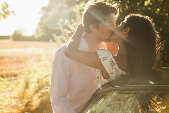 Couple Kissing in a Field

