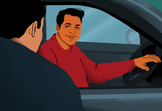 Smiling man behind steering wheel talking to friend at car window
