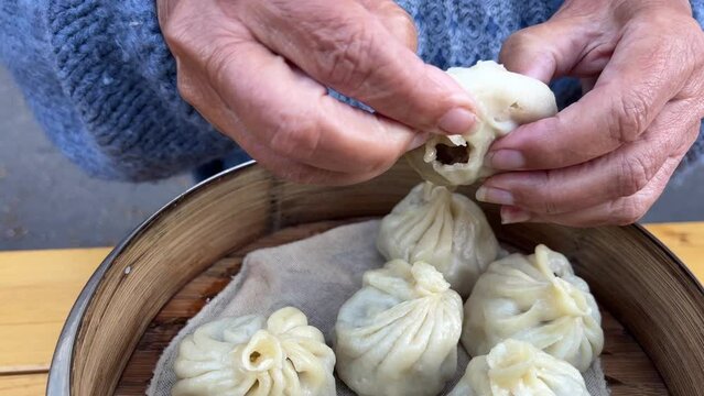 Eating steamed hot meat dumplings pelmeni
