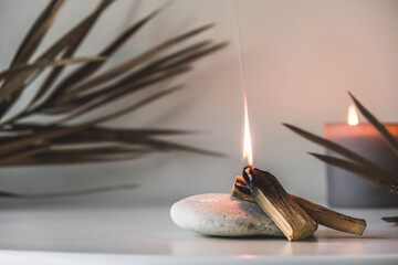 Palo Santo sticks on a light background.Aromatherapy religious rituals meditation.Wellness with...