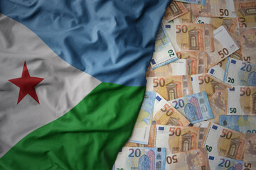 colorful waving national flag of djibouti on a euro money background. finance concept