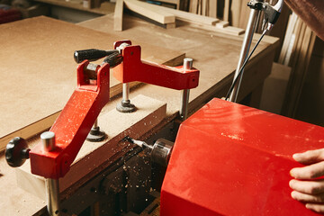 Milling machine cuts a hole for locks, hinges and keyholes.