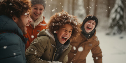 Kids and parents laughing during snowball fight in the forest - obrazy, fototapety, plakaty