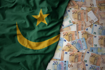 colorful waving national flag of mauritania on a euro money background. finance concept