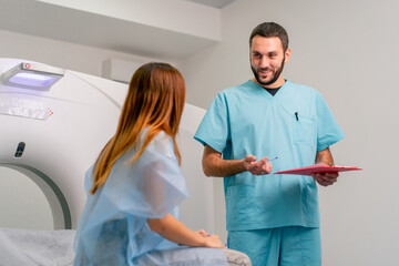 A radiologist describes to patient the results of her examination after diagnosis using an MRI...