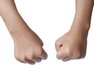 Little girls hand doing punching fist gesture, cut out isolated