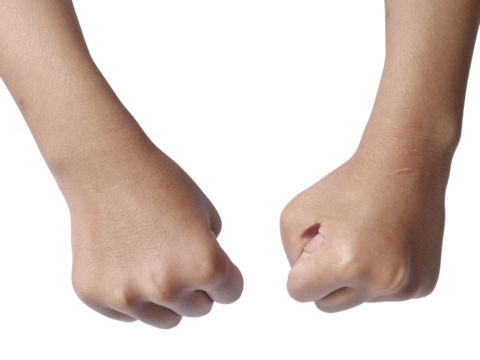 Little girls hand doing punching fist gesture, cut out isolated