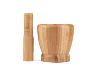 Wooden pestle next to a wooden mortar on a white background.