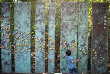 child in the arboretum