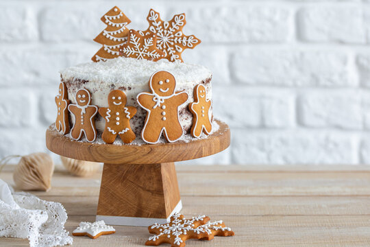 Christmas winter cake decorated with gingerbread cookies