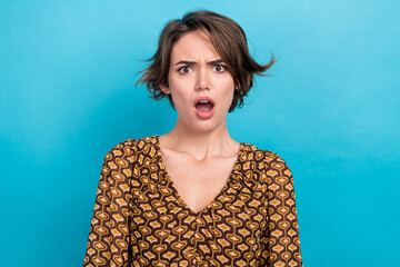 Photo of stressed confused young woman wear trendy blouse open mouth shocked staring not believe you isolated on blue color background