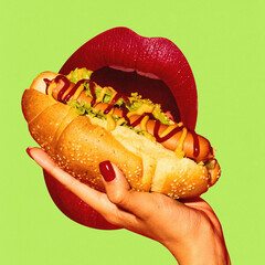 Giant female mouth with red lipstick tasting delicious hot dog against green background....