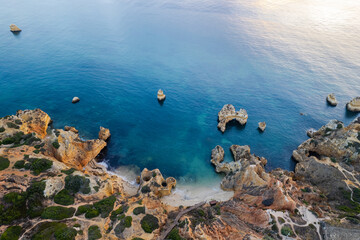 Praia do Camilo or Camilo Beach in Algarve, Portugal. Top down drone view