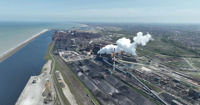 A large iron and steel factory in the town of Groot Sinten Grande Synthe, near Dunkirk, France. It is an integrated iron and steel company with blast furnaces, steel mills and rolling mills covering a