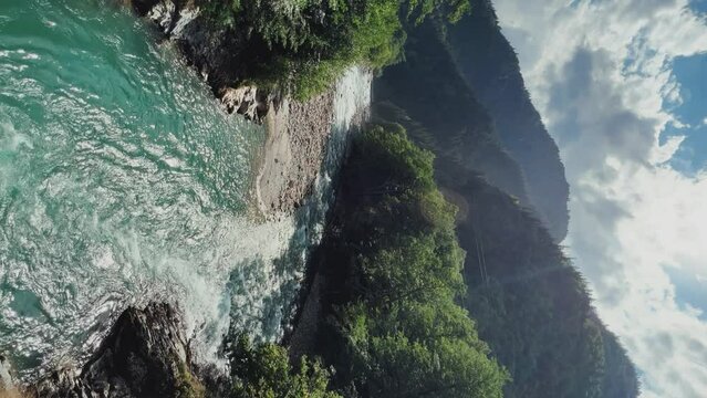 The Bolshaya Laba River. A mountain emerald river in a narrow, sunlit canyon. Bolshaya Laba River near the village of Psemen in Karachay-Cherkessia, Russia. Panoramic view. 4K