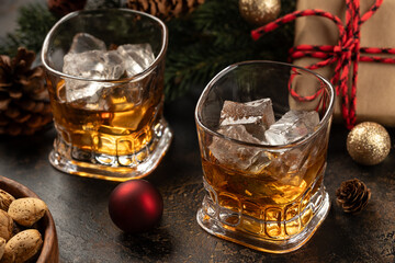 Two glasses of whiskey with ice