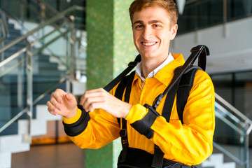 Portrait of an employee with an exoskeleton from a futuristic high-tech warehouse, help to improve...