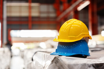 Multicolored Safety Construction Worker Hats. Teamwork of the construction team must have quality. Whether it is engineering, construction workers. Have a helmet to wear at work. For safety at work. - obrazy, fototapety, plakaty