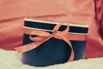 gift surprise box with red ribbon