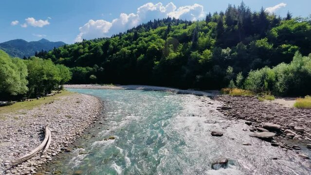 The Bolshaya Laba River. A mountain emerald river in a narrow, sunlit canyon. Bolshaya Laba River near the village of Psemen in Karachay-Cherkessia, Russia. Panoramic view. 4K