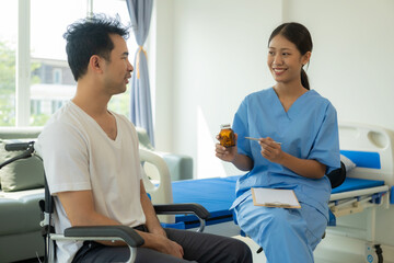 Obraz premium Asian female doctor caring for and counseling a male patient lying on the patient's bed for Health check, medical concept. Health check. Asian model.