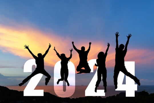 Silhouette happy business teamwork jumping congratulation and celebrate in Happy New year 2024 for change new life future concept. Freedom lifestyle group people team jump part of Number 2024 success