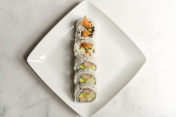 sushi roll with shrimp tempura, avocado and crab