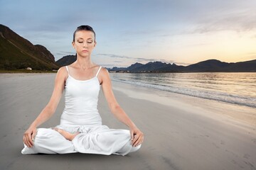 Fototapeta na wymiar Yoga meditation young woman at seaside