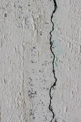 Texture of old cracked concrete wall. Rough gray concrete surface. Great for background and design. Close-up. High resolution.