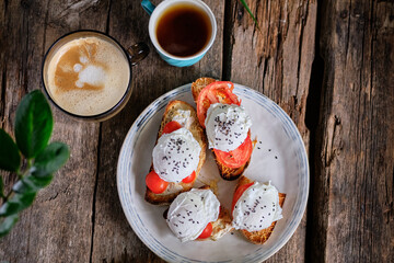Fried toast with tomatoes and poached egg. Top view, close-up.