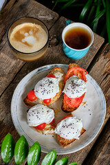 Fried toast with tomatoes and poached egg. Top view, close-up.
